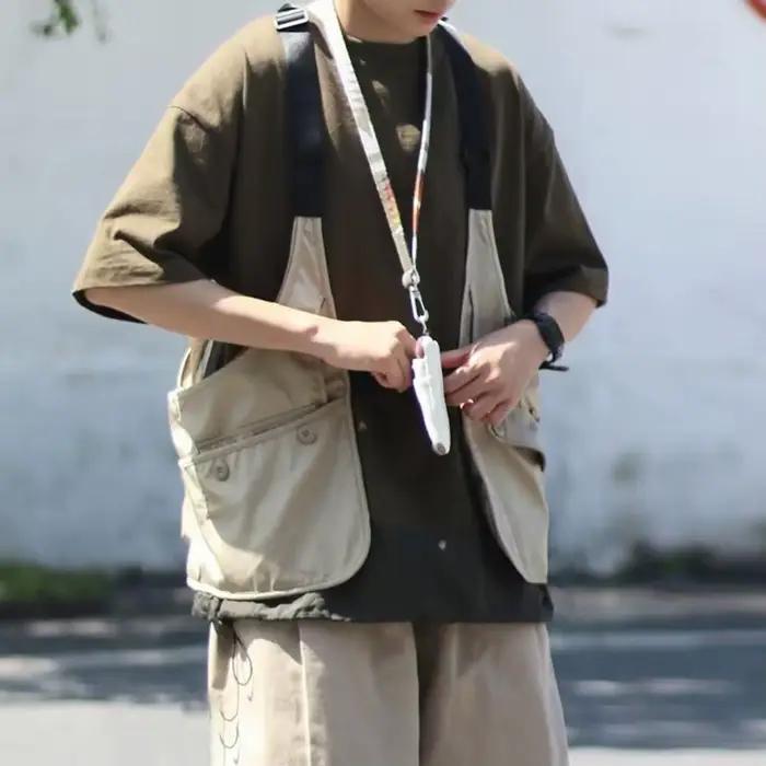 Gilet à poches multiples style streetwear pour pêcheurs avec rangements pratiques accessoires