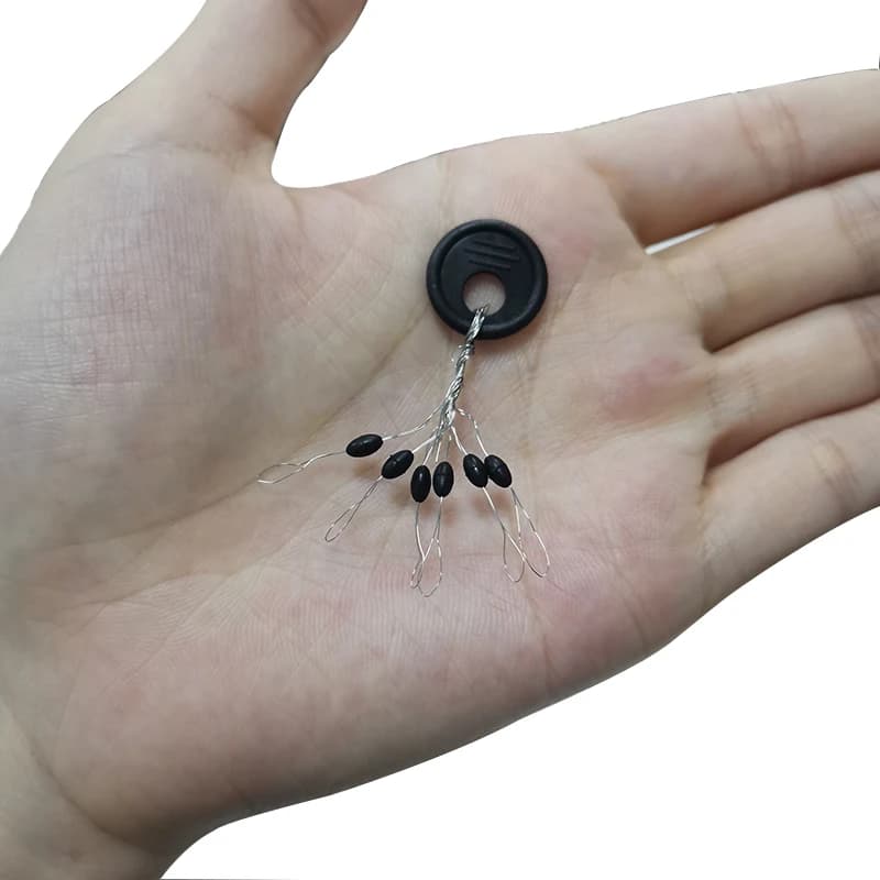 100 groupes connecteurs ovales espace haricot 6 en 1 - Arrêts flotteurs noirs pour ligne de pêche accessoires
